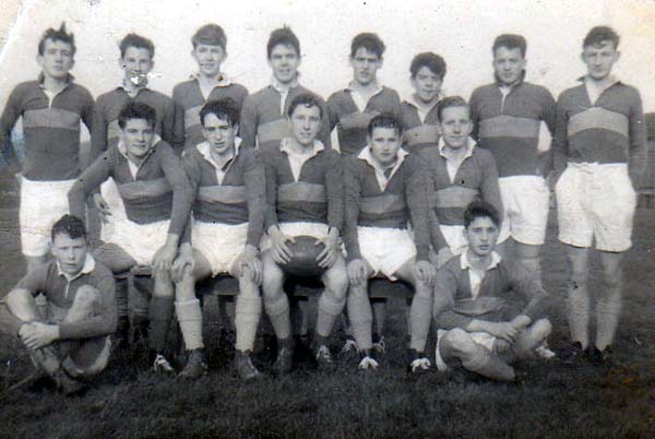 Scotus First XV 1960-1.jpg - Scotus XV 1960 John Lynch, Joe Flaherty,Tony Kelly, Chris Barlow, John Kelly, Ronnie Rowley, ?, Leo Stone Tony Thain, Laurie Cassidy,Mike Sexton,Eddie Jones, John C.Hunter,John Perrins, Roddy Zentil Photo of the team 60/61. We didn't win many matches that year as most of the team came from the 4th  form, so we usually had a weight disadvantage. (Notes from Mike Sexton)  The middle row were mostly 6th form (perhaps an odd one from 5th)   The photo was taken right at the end of the season, hence my position as  Acting Captain. Tich Clarke was the Team Captain but missed the last couple of matches through a cartilage injury.